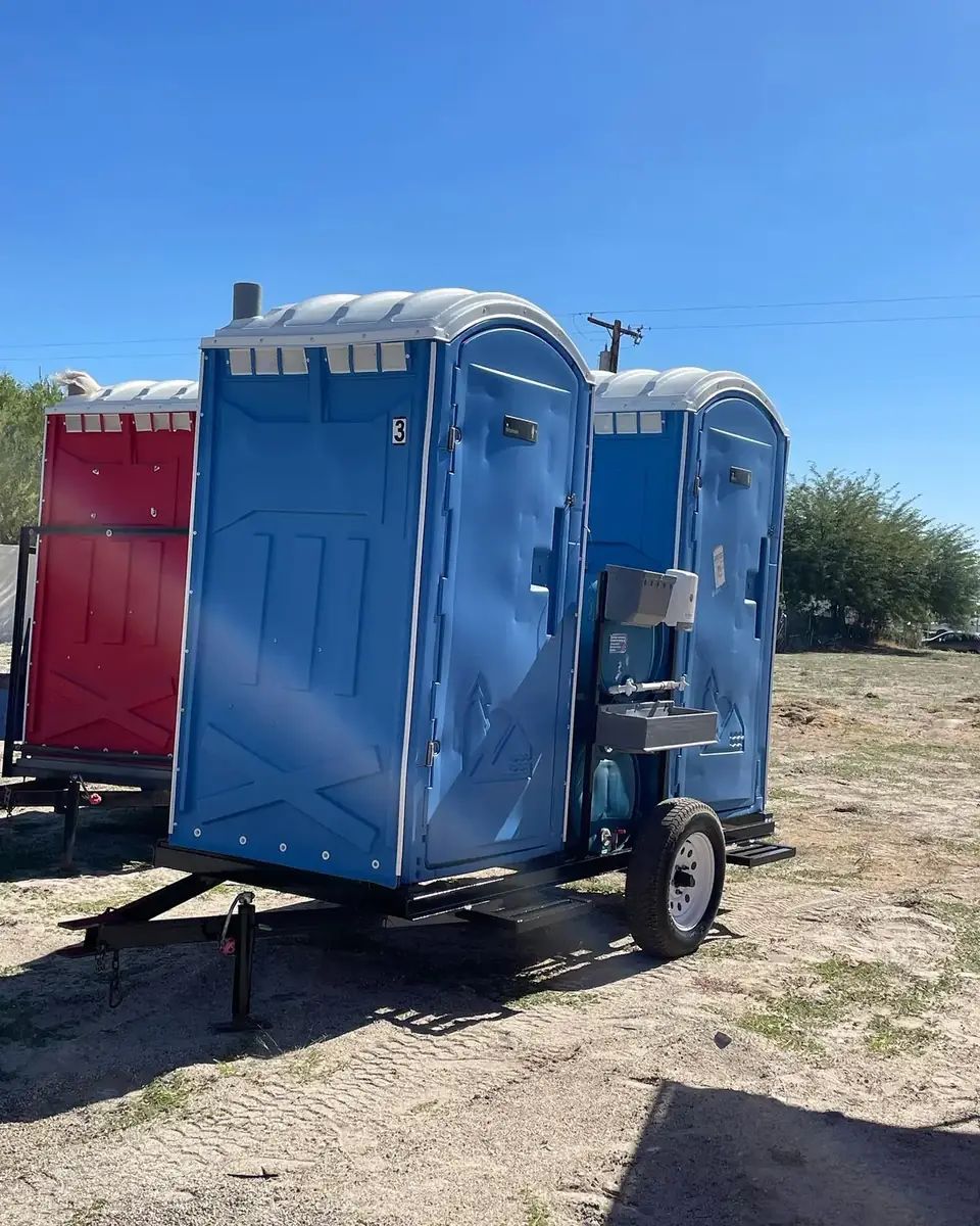 Portable toilets loaded on a trailer for delivery